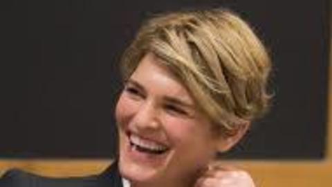 Jody Freeman smiling while interviewed looking to the left
