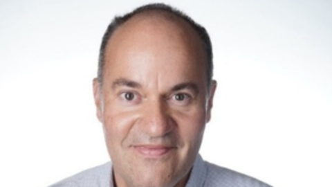 Matthew Kahn looking forward on white background